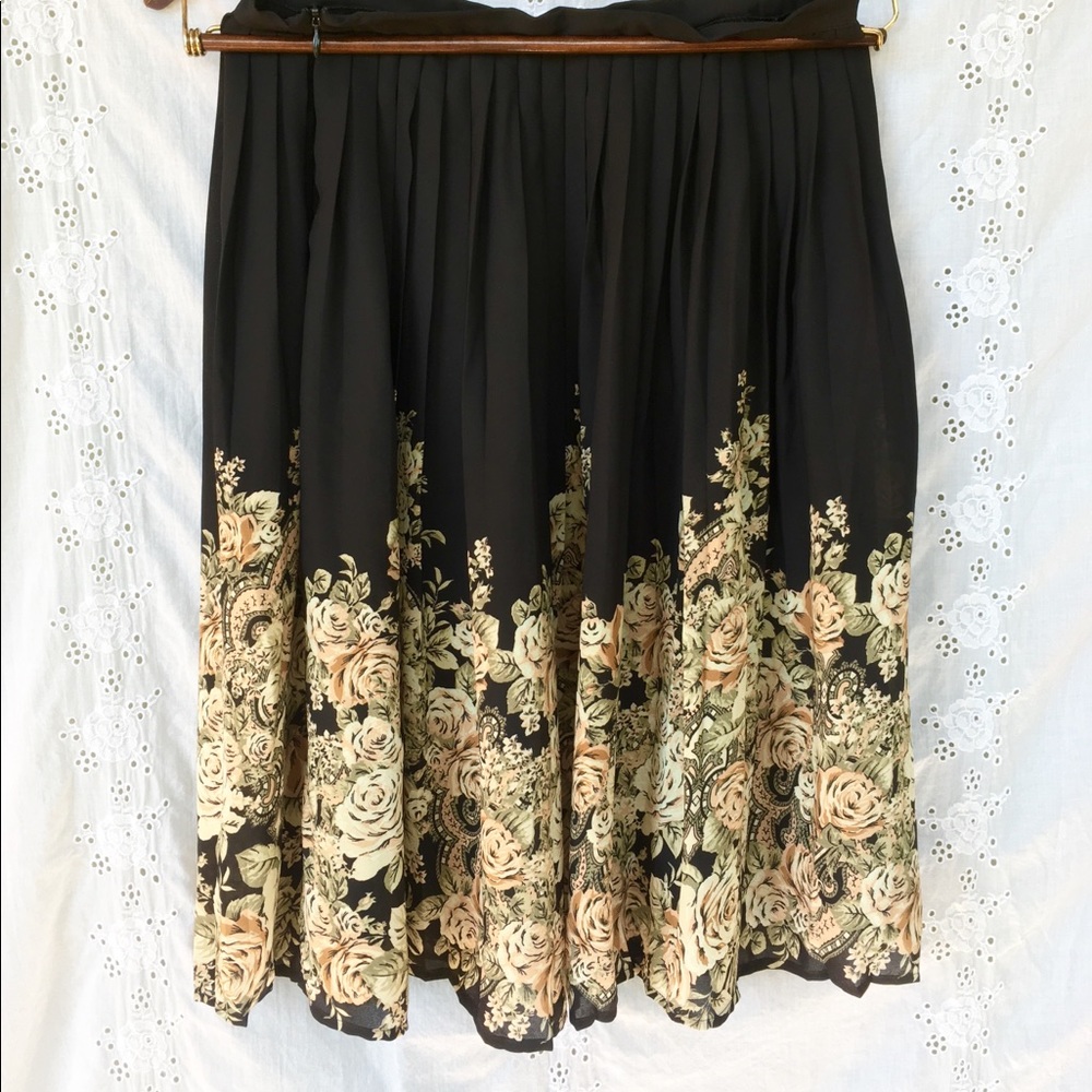 Black pleated skirt with neutral floral pattern